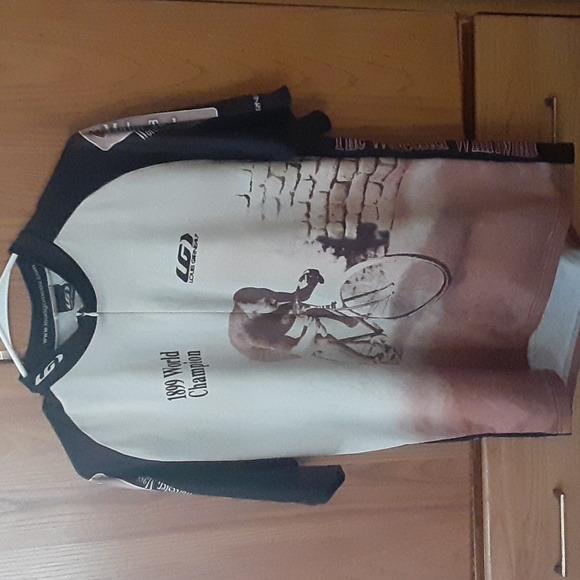 A beige cream and black biker shirt in good condition ready for u to sport - Picture 1 of 2